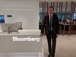 Svend Janssen posing by Bloomberg desk