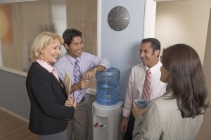 Businesspeople gathering at water cooler
