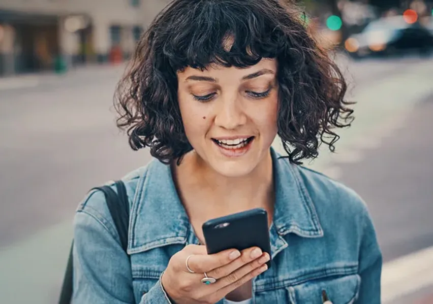 curly_girl_checking_her_phone