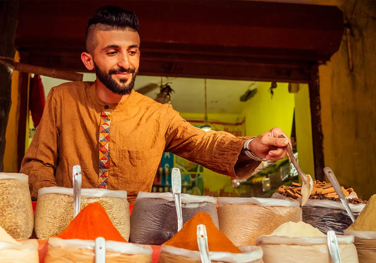 Turkish man working at spice store