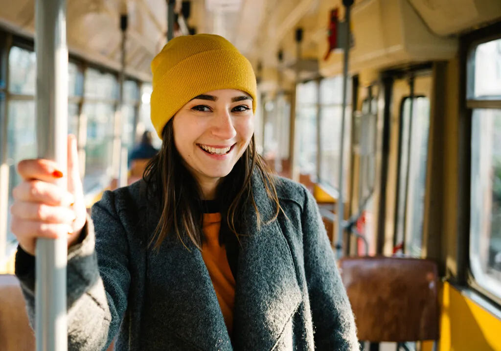 Picture of a smilling woman on a bus