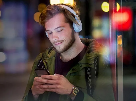man_phone_headphones_dark